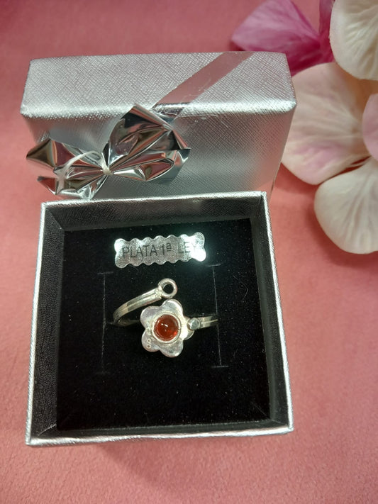 Sterling silver ring with red mineral stone in a flower