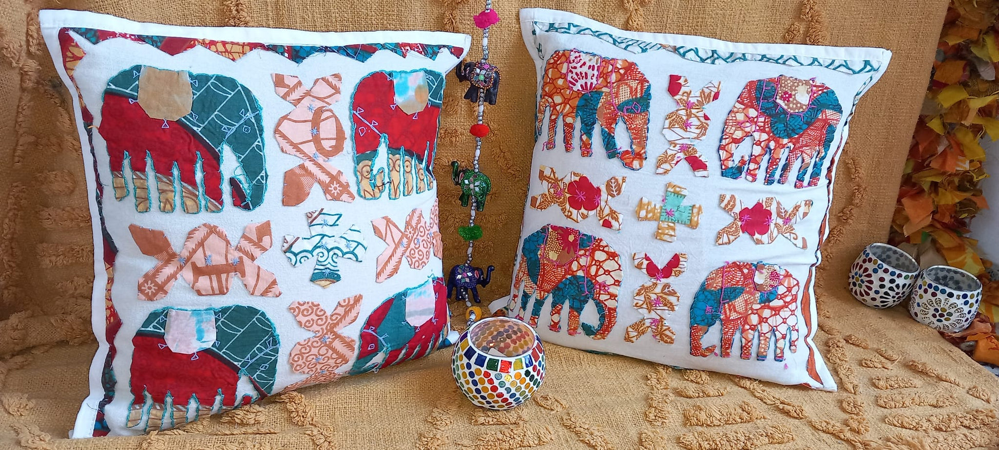 Pack 2 fundas de cojín DHARMA INDIA. Un toque bohemio y artesanal para cualquier espacio. Este pack de 2 fundas de cojín elefante DHARMA INDIA son una pieza única, confeccionadas con retales de tejidos tradicionales llenos de historia. Sus vibrantes colores, detalles artesanales hechos a mano las convierten en un complemento perfecto para quienes buscan decorar con personalidad y autenticidad. Su apertura trasera facilita la colocación del relleno, aportando comodidad y practicidad.